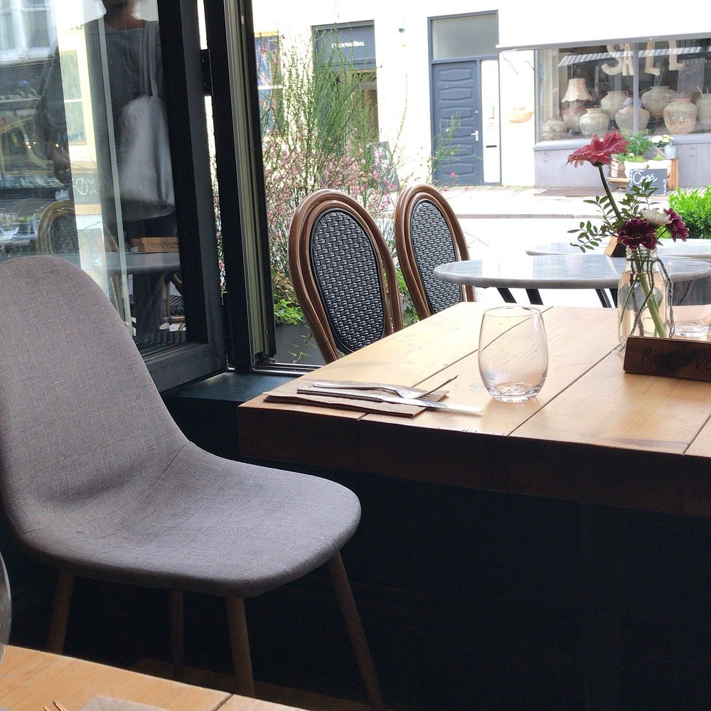 A table set beside the open window at SIX