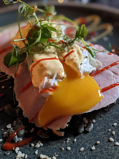 Poached eggs served with fresh greens