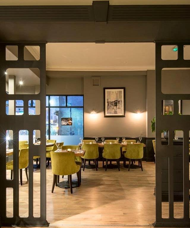 A view through the dark framed entrance into the SIX dining room