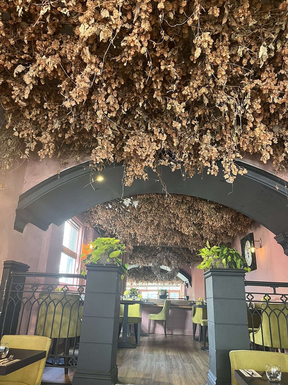 The dried flower ceiling and archways inside SIX